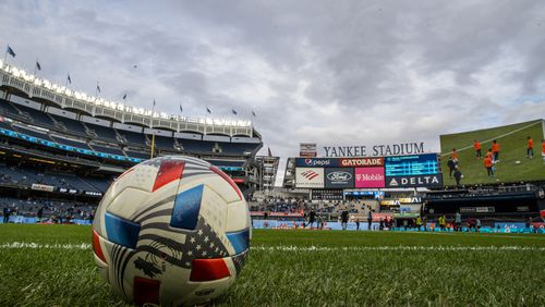 Players for New York City FC and Atlanta United warm up before an MLS soccer match at Yankee Stadium, Sunday, Nov. 21, 2021, in New York. (AP Photo/Eduardo Munoz Alvarez)