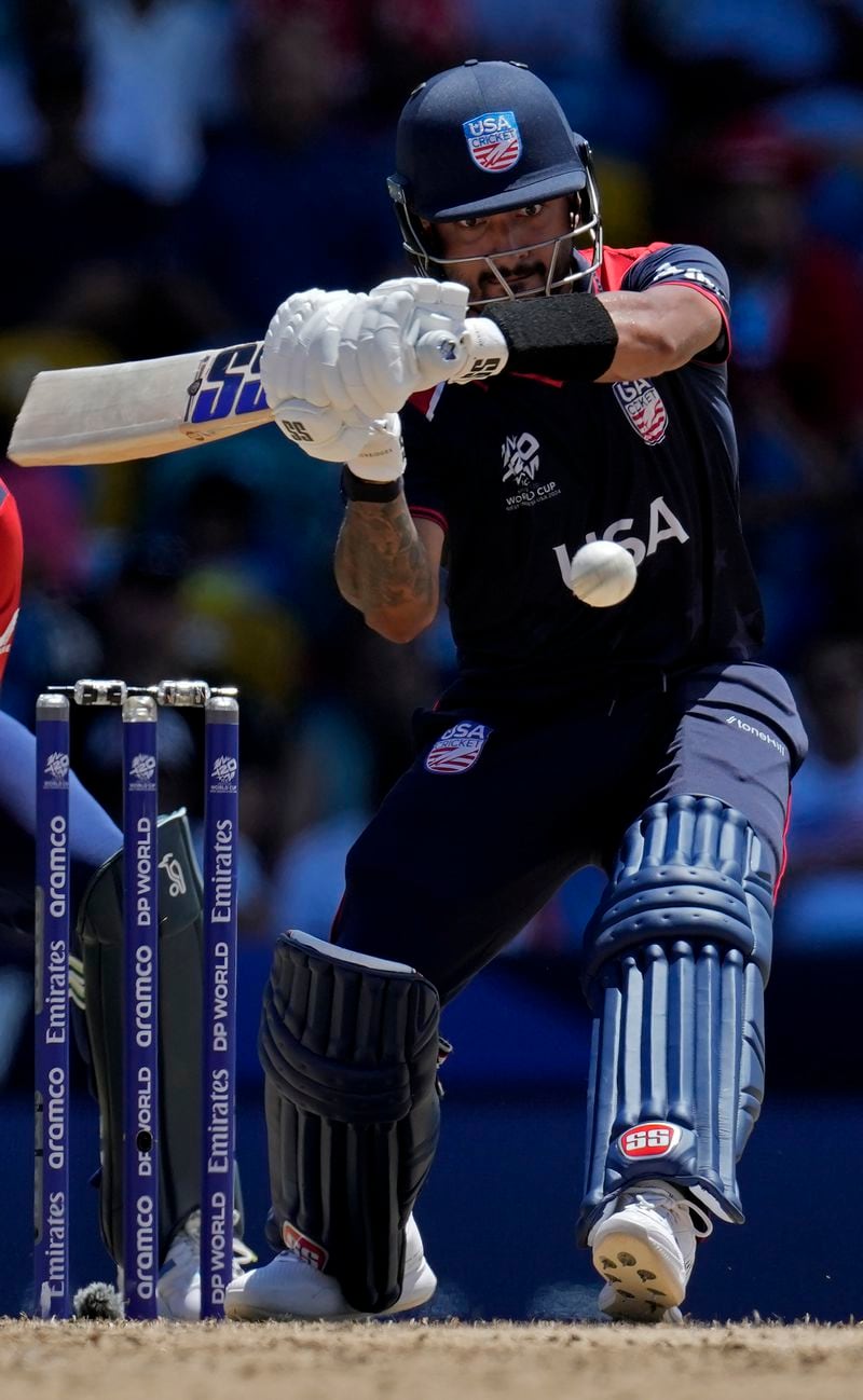 United States' Nitish Kumar plays a shot during the ICC Men's T20 World Cup cricket match between the United States and England at Kensington Oval in Bridgetown, Barbados, Sunday, June 23, 2024. (AP Photo/Ricardo Mazalan)