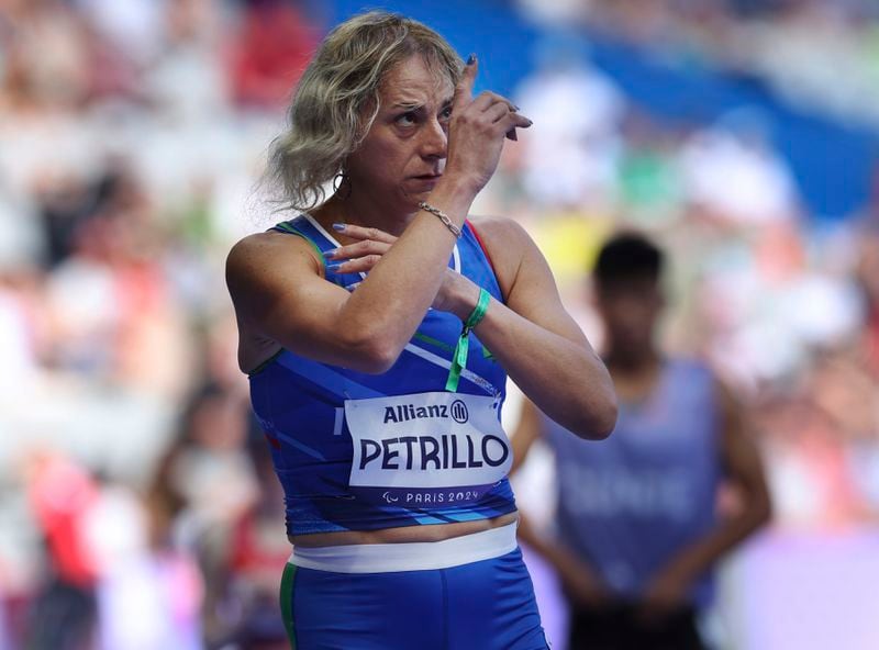 Italy's Valentina Petrillo prepares to compete in the women's 400m T12 round 1, at the Stade de France Stadium, during the 2024 Paralympics, Monday, Sept. 2, 2024, in Paris, France. (AP Photo/Jackson Ranger)