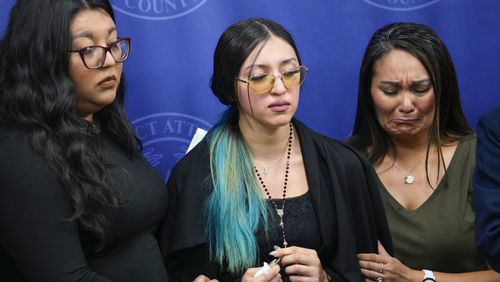 Alexis Nungaray, the mother of Jocelyn Nungaray, center, is embraced by Tiffany Carmona, left, and Jackie Major after speaking about her daughter during a news conference after Franklin Peña, one of the two men accused of killing the 12-year-old girl, appeared in court, Monday, June 24, 2024, in Houston. Peña was ordered held on $10 million bail as he and another man, Johan Jose Rangel-Martinez, are charged with capital murder over the girl's death. (Brett Coomer/Houston Chronicle via AP)