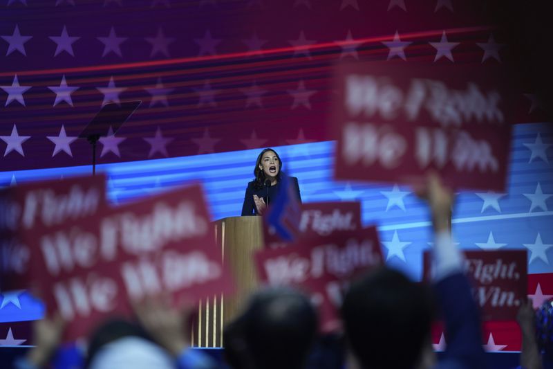 Rep. Alexandria Ocasio-Cortez, D-N.Y., speaks during the Democratic National Convention Monday, Aug. 19, 2024, in Chicago. (AP Photo/Erin Hooley)