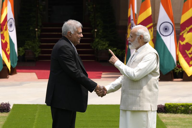 Indian Prime Minister Narendra Modi welcomes then Sri Lankan President Ranil Wickremesinghe before their delegation level meeting in New Delhi, India, July 21, 2023. (AP Photo/Manish Swarup, File)