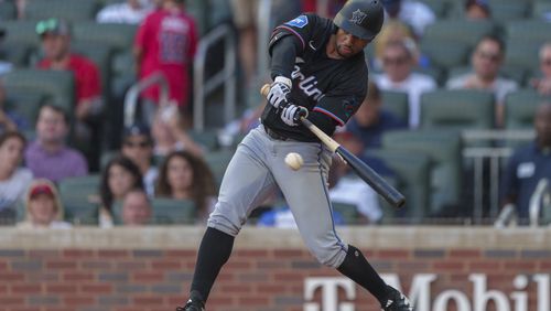 Miami Marlins Xavier Edwards swings for a strike in the first inning of a baseball game against the Atlanta Braves, Saturday, Aug. 3, 2024, in Atlanta. (AP Photo/Jason Allen)