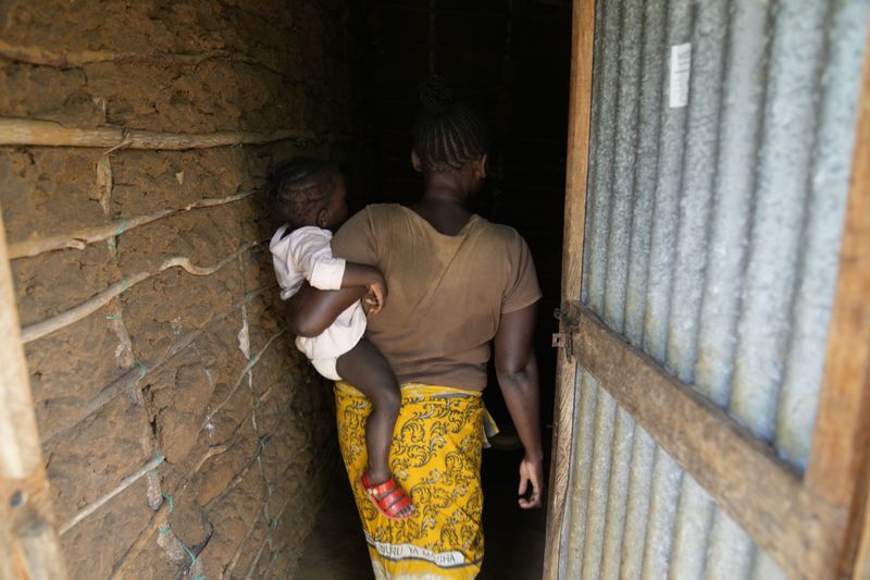 A woman who escaped the Good News International Church in Shakahola after she said she was sexually assaulted, enters a house in the coastal city of Malindi, in southern Kenya, on Friday, Sept. 6, 2024. (AP Photo/Brian Inganga)