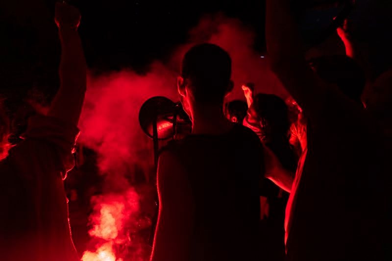 People block a road as they protest, calling for a deal for the immediate release of hostages held in the Gaza Strip by Hamas, in Tel Aviv, Israel, Sunday, Sept. 1, 2024. (AP Photo/Ohad Zwigenberg)