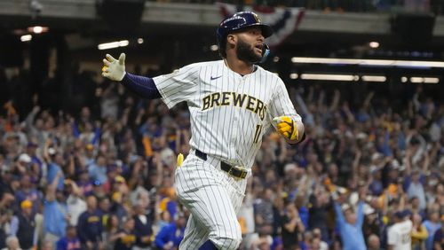 Milwaukee Brewers' Jackson Chourio reacts after hitting a home run during the eighth inning of Game 2 of a National League wild card baseball game against the New York Mets Wednesday, Oct. 2, 2024, in Milwaukee. (AP Photo/Morry Gash)