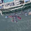 This satellite image from Planet Labs PBC shows what appears to be a sunken Chinese submarine at a shipyard near Wuhan, China, June 15, 2024. (Planet Labs PBC via AP)