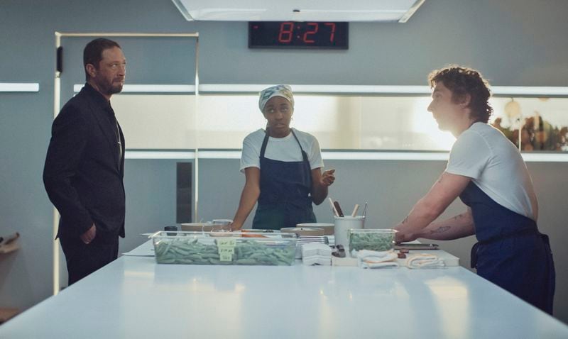 This image released by FX shows Ebon Moss-Bachrach, from left, Ayo Edebiri and Jeremy Allen White in a scene from "The Bear." (FX via AP)