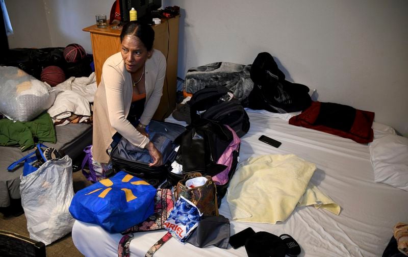 Sofia Roca, an immigrant from Colombia, packs up her belongings in Aurora, Colorado, on March 29, 2024, as she prepares to leave in search of work in another state. (AP Photo/Thomas Peipert)