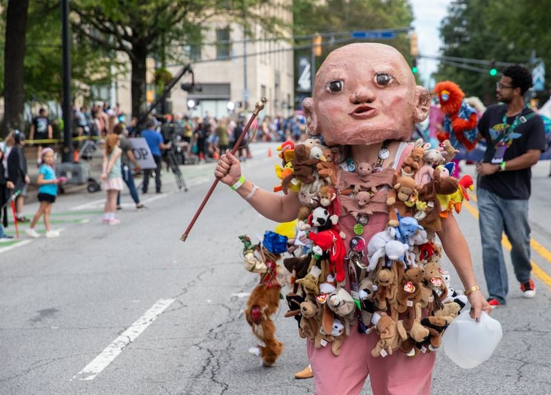 You never know what you'll see during the Dragon Con Parade, rolling out Aug. 31. Last year, Qate Bean drew great attention as Baby Head.  Jenni Girtman for the AJC