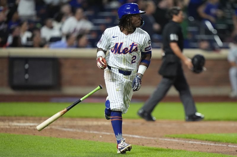 New York Mets' Luisangel Acuna tosses his bat as he runs the bases after hitting a home run during the eighth inning of a baseball game against the Washington Nationals, Tuesday, Sept. 17, 2024, in New York. (AP Photo/Frank Franklin II)