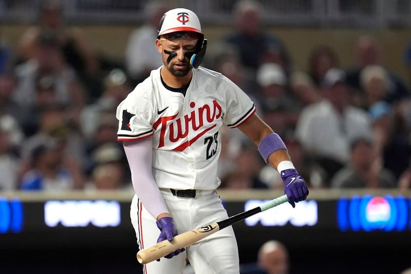 Minnesota Twins' Royce Lewis reacts after striking out to end the bottom of the fifth inning of a baseball game against the Atlanta Braves, Tuesday, Aug. 27, 2024, in Minneapolis. (AP Photo/Abbie Parr)