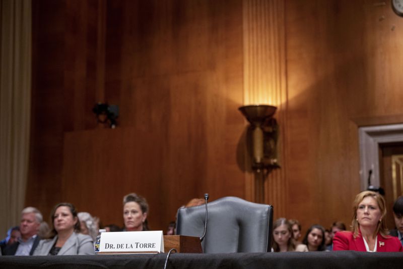 The chair reserved for Steward Health Care System CEO Ralph de la Torre sits empty after de la Torre failed to show and testify before the Senate Health, Education, Labor, and Pensions hearing to examine the bankruptcy of Steward Health Care on Thursday, Sept. 12, 2024 on Capitol Hill in Washington. (AP Photo/Kevin Wolf)