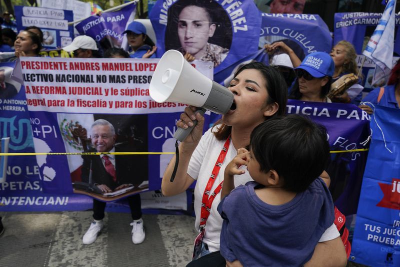 Relatives of prisoners rally in favor the government's proposed judicial reform in Mexico City, Wednesday, Sept. 4, 2024. (AP Photo/Felix Marquez)