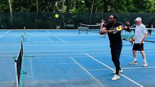 Mayor Andre Dickens plays pickleball