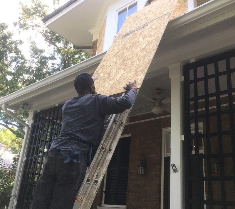 Leroy Fickling boards up a home in Savannah's Ardsley Park neighborhood ahead of Hurricane Irma. Photo: Jennifer Brett