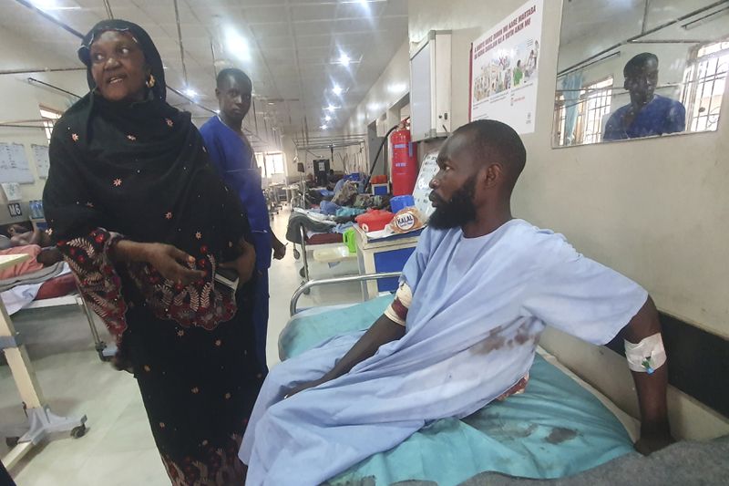 An injured victim of a suicide bomb attack receives treatment at a hospital in Maiduguri, Nigeria, Sunday, June 30, 2024. At least 18 people were killed and 30 injured, including 19 seriously, in coordinated attacks by suspected female suicide bombers in Nigeria's northeastern city of Gwoza on Saturday, local authorities said, raising security concerns in a region which has been at a center of Islamist insurgency. (AP Photo/Joshua Omiri)