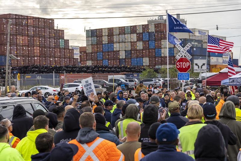 Workers take part in a port strike at Port Newark, Tuesday, Oct. 1, 2024, in Bayonne, N.J. (AP Photo/Eduardo Munoz Alvarez)