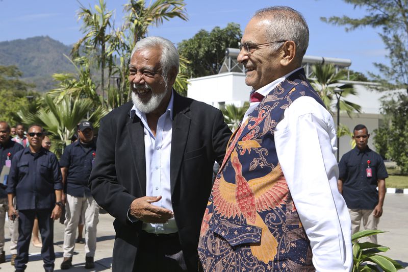 East Timor's President Jose Ramos Horta, right, and Prime Minister Xanana Gusmao share a laugh during a ceremony at the Presidential palace in Dili, East Timor on Thursday, Sept. 5, 2024. (AP Photo/Firdia Lisnawati)