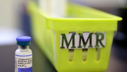 FILE - A vial of a measles, mumps and rubella vaccine sits on a countertop at a pediatrics clinic in Greenbrae, Calif., on Feb. 6, 2015. (AP Photo/Eric Risberg, File)