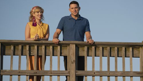This image released by Apple TV+ shows Scarlett Johansson and Channing Tatum, right, in a scene from "Fly Me to the Moon. (Dan McFadden/Apple TV+ via AP)