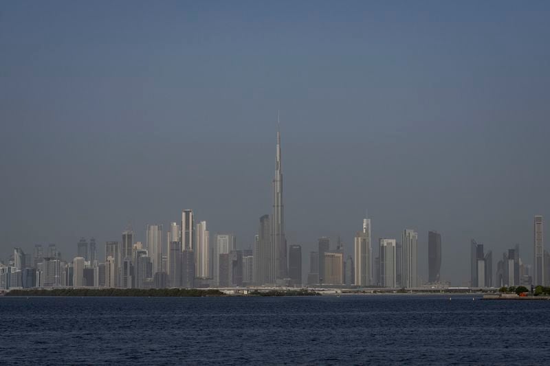 A general view of city skyline with Burj Khalifa, the world's tallest building is seen, in Dubai, United Arab Emirates, Tuesday, Aug. 13, 2024. (AP Photo/Altaf Qadri)