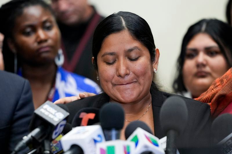 Maria del Carmen Castellón, the wife of Miguel Luna, a welder who died during the collapse of Baltimore's Francis Scott Key Bridge, becomes emotional while speaking during a press conference, Tuesday, Sept. 17, 2024, in Baltimore. (AP Photo/Stephanie Scarbrough)