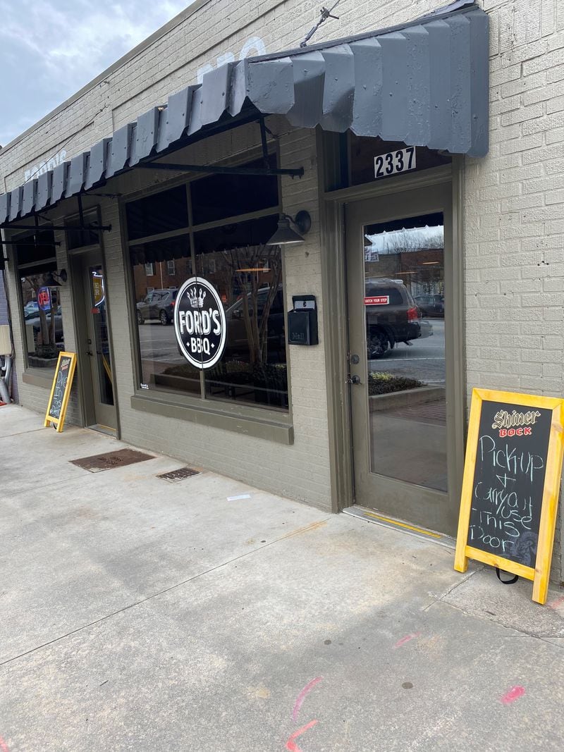 Ford’s BBQ in Tucker has separate sidewalk entrances for dine-in and takeout. Bob Townsend for The Atlanta Journal-Constitution 
