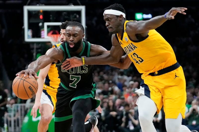 Boston Celtics guard Jaylen Brown (7) is defended by Indiana Pacers forward Pascal Siakam (43) during the second half of Game 2 of the NBA Eastern Conference basketball finals Thursday, May 23, 2024, in Boston. (AP Photo/Steven Senne)