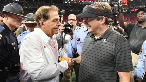 Alabama's head coach Nick Saban and Georgia's head coach Kirby Smart shake hands after Alabama beat Georgia during the Southeastern Conference championship NCAA college football game at during the Southeastern Conference championship NCAA college football game at Mercedes-Benz Stadium in Atlanta on Saturday, December 4, 2021. (Hyosub Shin / Hyosub.Shin@ajc.com)