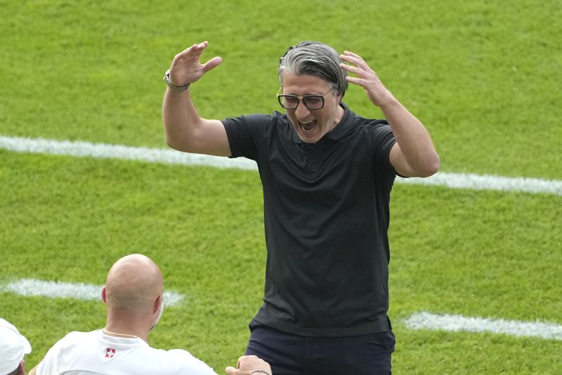 Switzerland coach Murat Yakin reacts during a round of sixteen match between Switzerland and Italy at the Euro 2024 soccer tournament in Berlin, Germany, Saturday, June 29, 2024. (AP Photo/Markus Schreiber)