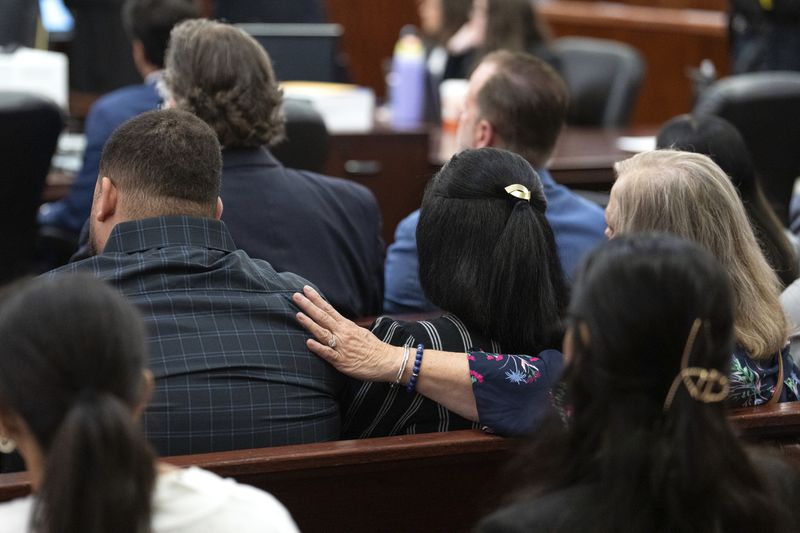 Family of Jocelyn Nungaray comfort each other as Franklin Peña, one of the two men accused of killing the 12-year-old girl, appears in court, Monday, June 24, 2024, in Houston. Peña was ordered held on $10 million bail as he and another man, Johan Jose Rangel-Martinez, are charged with capital murder over the girl's death. (Brett Coomer/Houston Chronicle via AP)