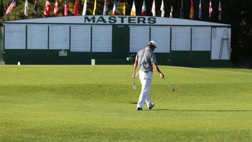 The scene is void of patrons as Hideki Matsuyama makes his way across the first fairway during the practice round for the Masters Monday, Nov. 9, 2020, at Augusta National Golf Club in Augusta, Ga. The tournament is being played without patrons.   (Curtis Compton / Curtis.Compton@ajc.com)