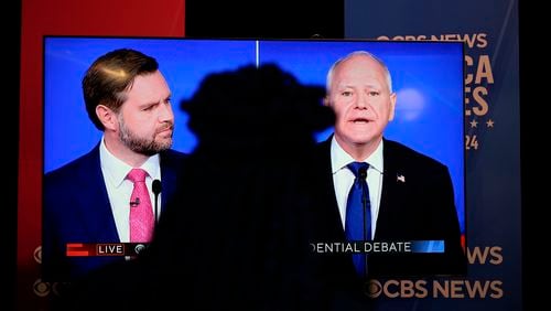 Viewers in the spin room watch the CBS News vice presidential debate, Tuesday, Oct. 1, 2024, in New York. (AP Photo/Julia Demaree Nikhinson)