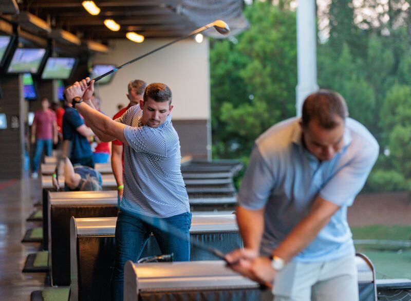 Braves third baseman Austin Riley (center) hosted the Driving for Veterans charity event at Topgolf  in 2022. (Arvin Temkar / arvin.temkar@ajc.com)