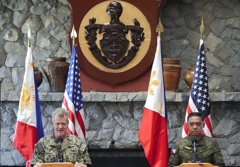 U.S. Indo-Pacific Command Commander Admiral Samuel Paparo, left, and Philippines military chief Gen. Romeo Brawner Jr.,answer questions during a press conference on the Mutual Defense Board-Security Engagement Board held at the Philippine Military Academy in Baguio, northern Philippines on Thursday, Aug. 29, 2024. (AP Photo/Aaron Favila)