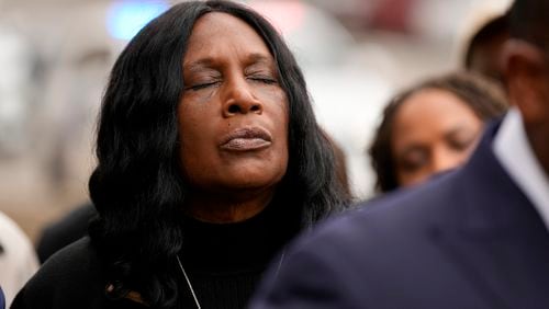 RowVaughn Wells, mother of Tyre Nichols, closes her eyes during a prayer vigil outside the federal courthouse during the trial of three former Memphis police officers accused of killing her son Wednesday, Sept. 25, 2024, in Memphis, Tenn. (AP Photo/George Walker IV)