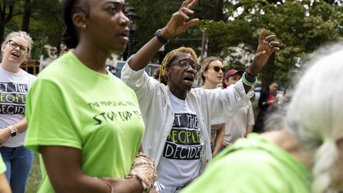 Opponents of an under-construction law enforcement training center, known to some as "Cop City," protest at City Hall in Atlanta on Monday, Sept. 16, 2024. (Arvin Temkar/Atlanta Journal-Constitution via AP)