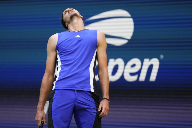 Alexander Zverev, of Germany, reacts in the fourth set against Taylor Fritz, of the United States, during the quarterfinals of the U.S. Open tennis championships, Tuesday, Sept. 3, 2024, in New York. (AP Photo/Kirsty Wigglesworth)