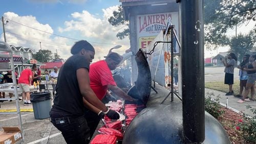 Employees at Lanier's Fresh Meat Market grilled hotdogs for local residents on Monday, September 30, 2024. (Photo Courtesy of Charmain Z. Brackett/Augusta Good News)