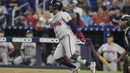 Atlanta Braves' Ozzie Albies follows a line drive to right field during the first inning of a baseball game against the Miami Marlins, Friday, Sept. 20, 2024, in Miami. (AP Photo/Marta Lavandier)