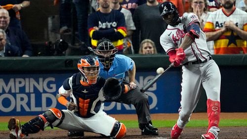 FILE - Atlanta Braves' Jorge Soler hits a three-run home run during the third inning in Game 6 of baseball's World Series between the Houston Astros and the Atlanta Braves Tuesday, Nov. 2, 2021, in Houston. The Braves would love to see him recreate that magic as they prepare for another postseason run by continuing to reunite members of that championship team. (AP Photo/Sue Ogrocki, File)