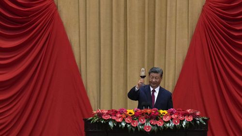 Chinese President Xi Jinping makes a toast on stage after delivering his speech at a dinner marking the 75th anniversary of the founding of the People's Republic of China, at the Great Hall of the People in Beijing, Monday, Sept. 30, 2024. (AP Photo/Andy Wong)