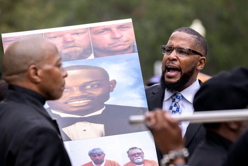 FILE - Dozens of Black Lives Matter and Black Panther protesters gather outside the Glynn County Courthouse where the trial of Travis McMichael, his father, Gregory McMichael, and William "Roddie" Bryan is held, Nov. 22, 2021, in Brunswick, Ga. (AP Photo/Stephen B. Morton, File)