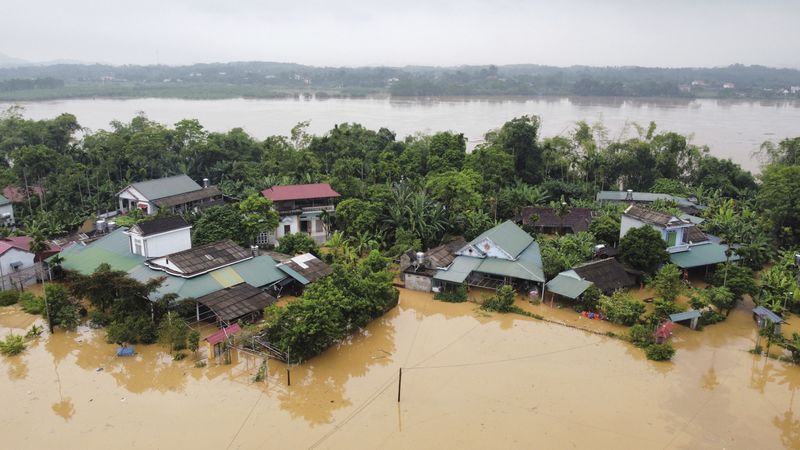 Flood triggered by Typhoon Yagi submerges houses in Phu Tho province, Vietnam Monday, Sept. 9, 2024. (Ta Van Toan/VNA via AP)