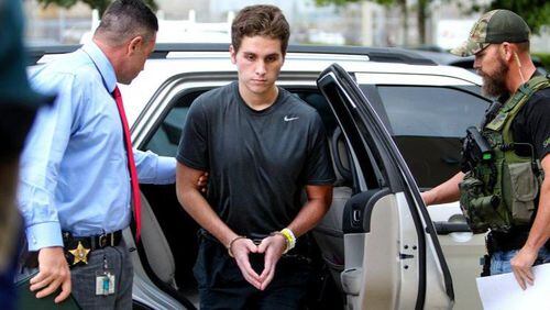 Austin Harrouff is transported by detectives to the Martin County Jail from St. Mary’s Hospital on October 3, 2016. Harrouff, who allegedly fatally stabbed a Martin County couple in their home on August 15th, has officially been charged with two counts of first-degree murder. (Richard Graulich / The Palm Beach Post)