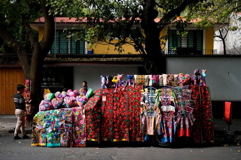 FILE - A car covered with handicrafts for sale is parked on a street in Mexico City, Dec. 4, 2023. Mexican President Andres Manuel Lopez Obrador swept into office in 2018 with the motto laying out his administration’s priorities: “For the good of all, first the poor.” (AP Photo/Eduardo Verdugo, File)