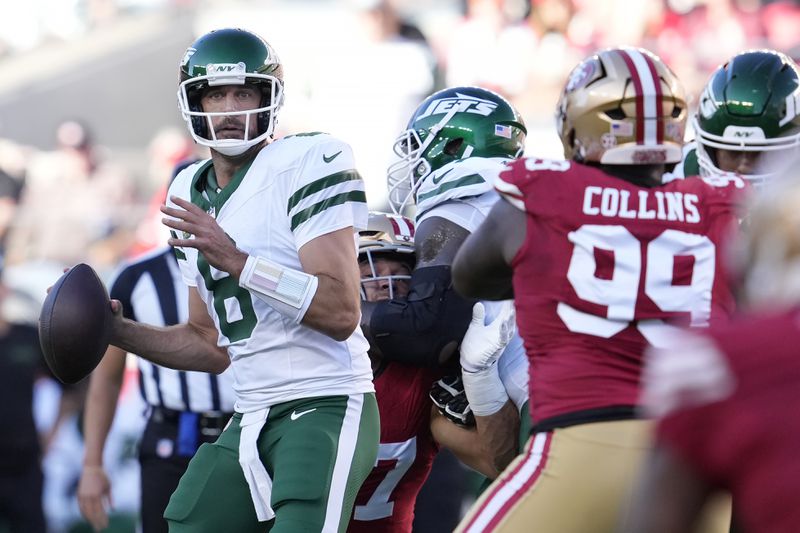 New York Jets quarterback Aaron Rodgers (8) looks to pass the ball during the first half of an NFL football game against the San Francisco 49ers in Santa Clara, Calif., Monday, Sept. 9, 2024. (AP Photo/Godofredo A. Vásquez)