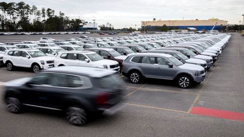 FILE - In this photo provided by the Georgia Port Authority, international longshoremen drive some of the first Kia Tellurides to be exported via the Port of Brunswick to the roll-on/roll-off vessel Sirius, Tuesday Feb., 26, 2019, at Colonel's Island Terminal in Brunswick, Ga. The Georgia Ports Authority says it moved a record number of automobiles across its docks in the 2024 fiscal year, bringing it neck-and-neck with the top U.S. auto port. (Stephen Morton/Georgia Port Authority via AP, File)