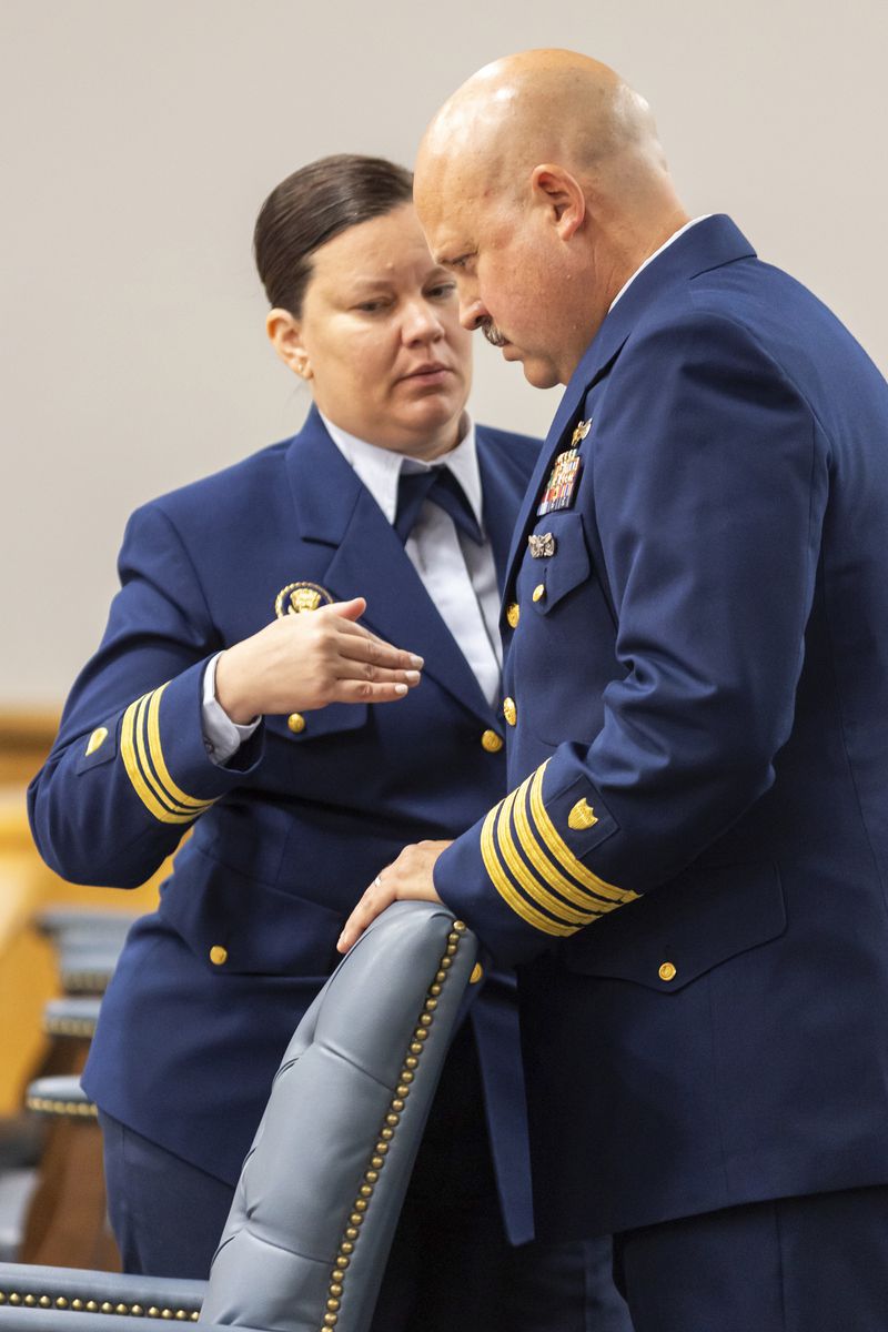 Jamie Frederick, at right, with the U.S. Coast Guard Sector Boston, speaks with Coast Guard legal counsel Jessie Brenton during a break during the final day of the Coast Guard investigatory hearing on the causes of the implosion of an experimental submersible headed for the wreck of the Titanic, Friday, Sept. 27, 2024, in North Charleston, S.C. (AP Photo/Mic Smith)